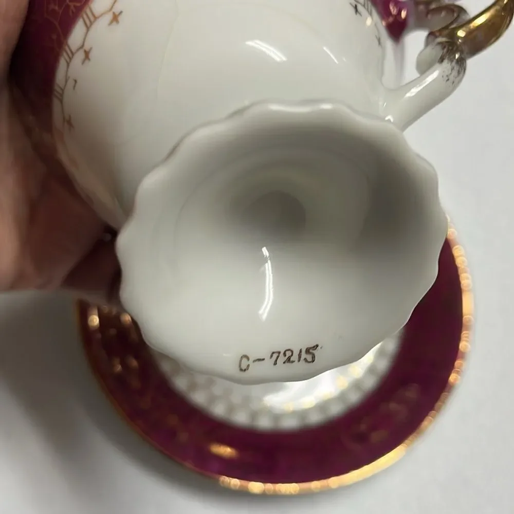 Elegant Gold and Burgundy Teacup and Saucer